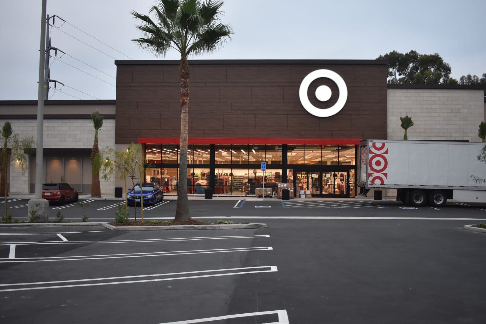 Big-box storefront with fresh stripes over a new seal coat