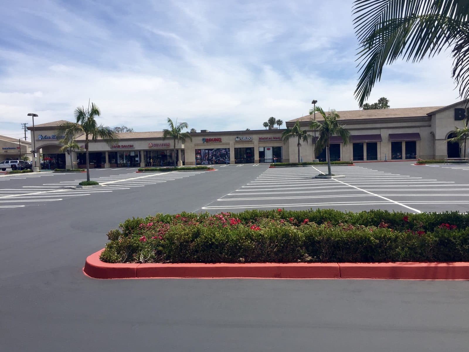 Strip-mall re-stripe with a red fire-lane curb